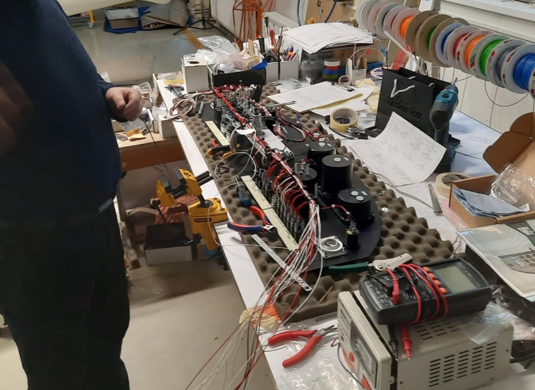 Belmont wiring harness being hand-assembled and tested on the workshop bench