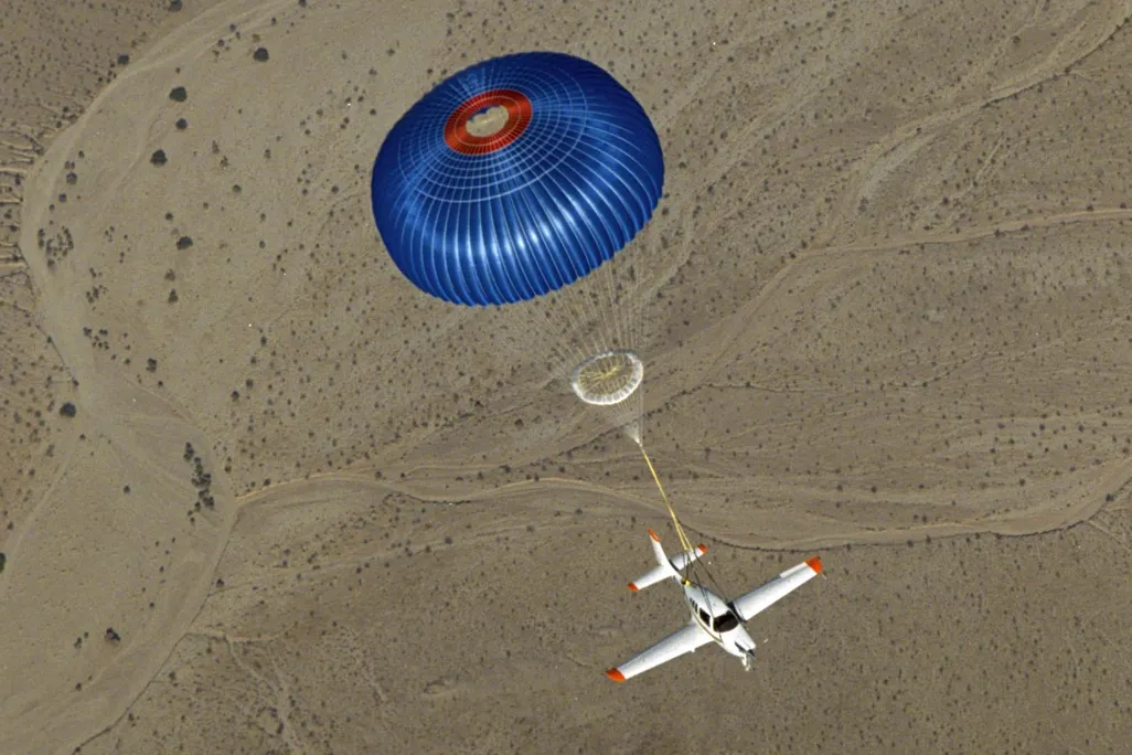 Belmont light sport aircraft descending under a deployed whole-airframe parachute