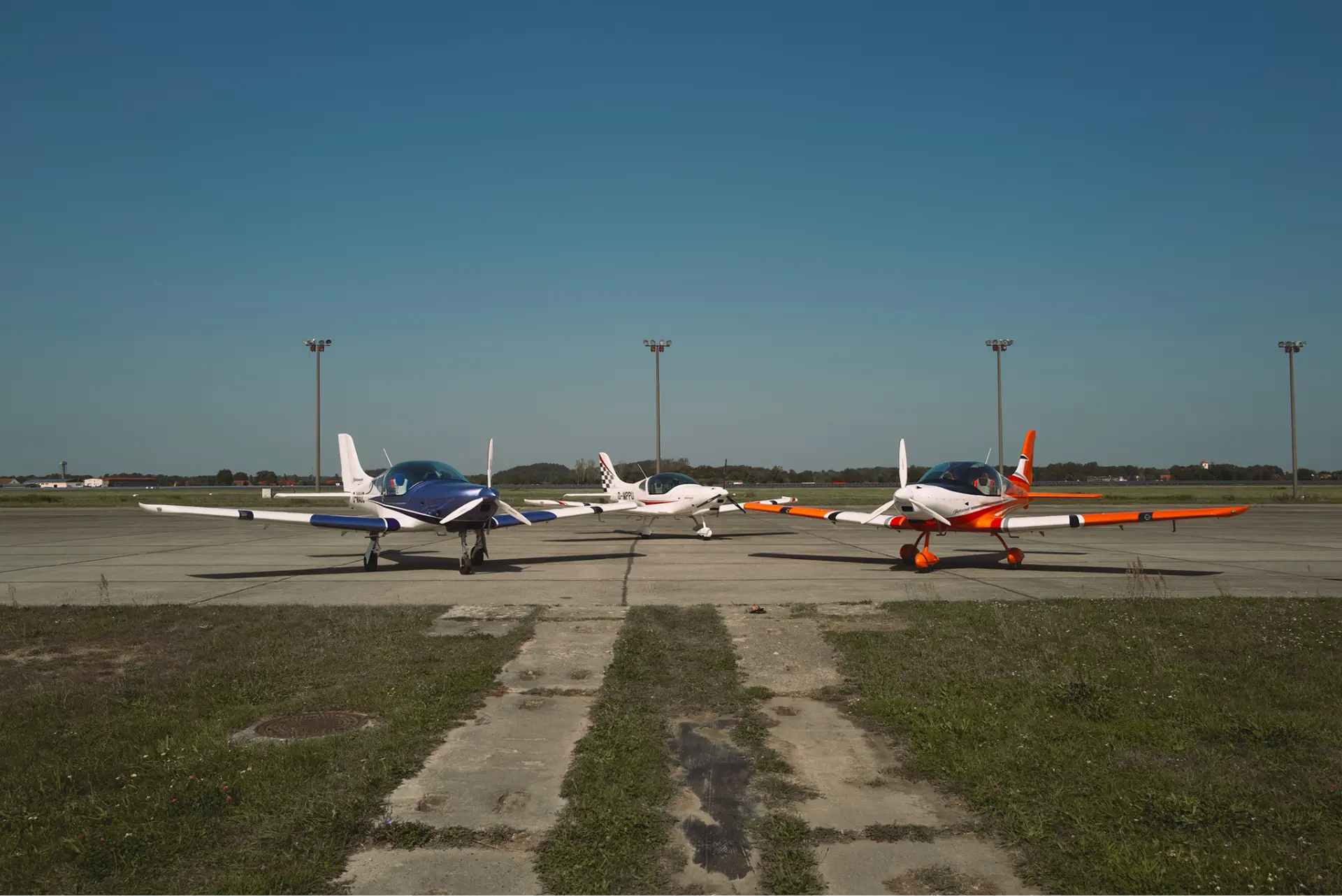 Three Belmont aircraft parked on the ramp in Latvia