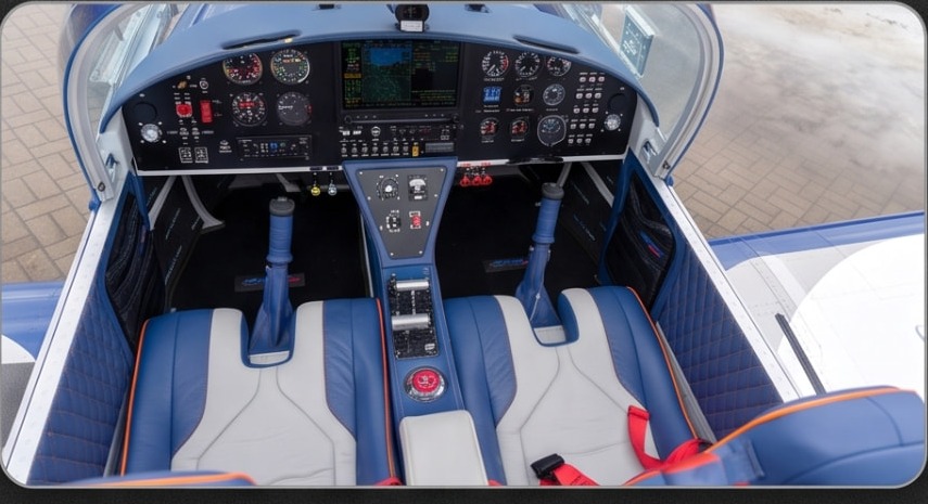 Blue and white leather cockpit with glass panel