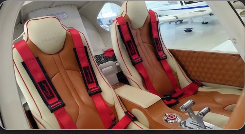 Tan and cream leather seats with red Belmont harnesses