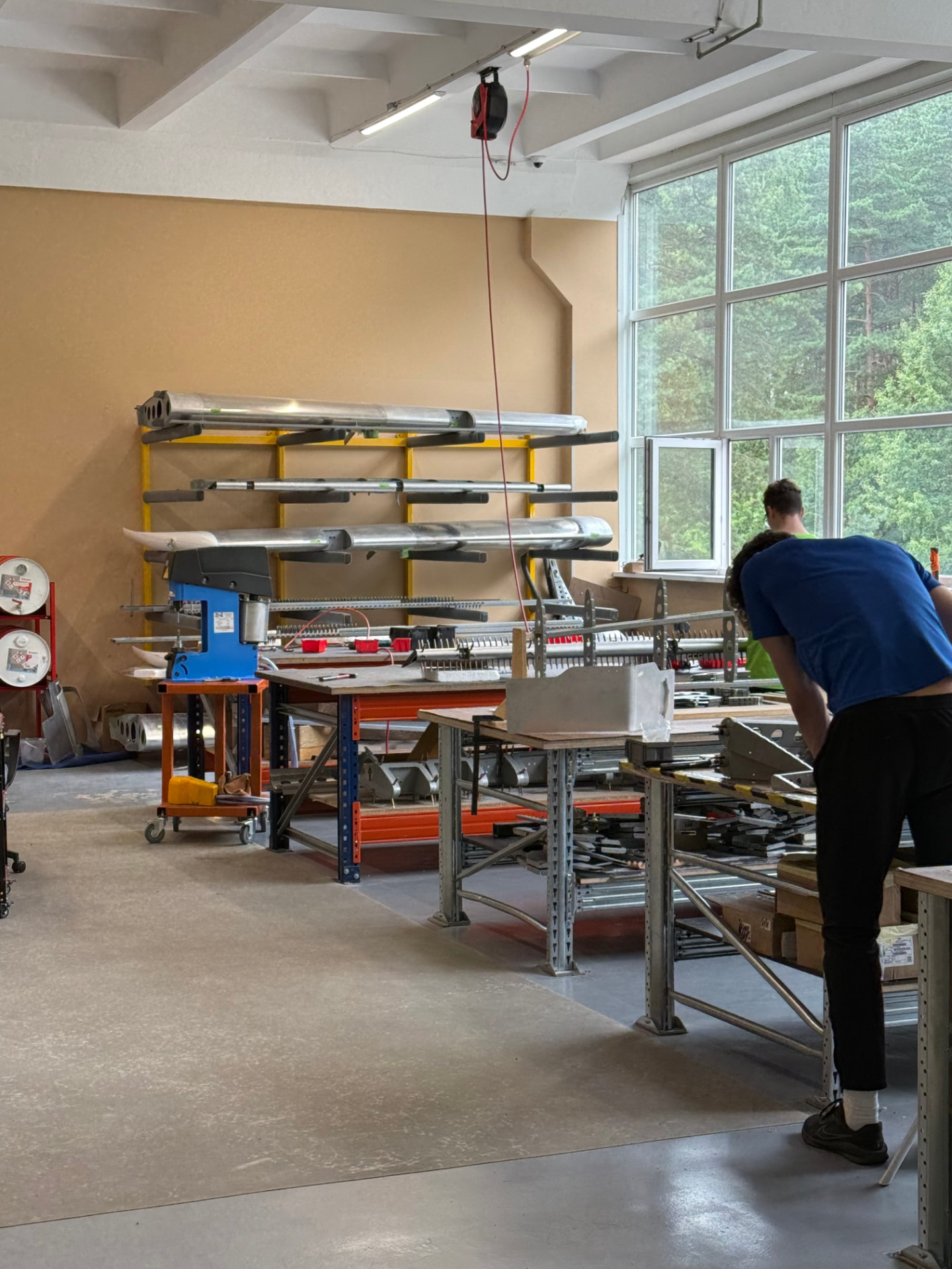 Belmont craftsmen at the assembly benches inside the Latvian workshop